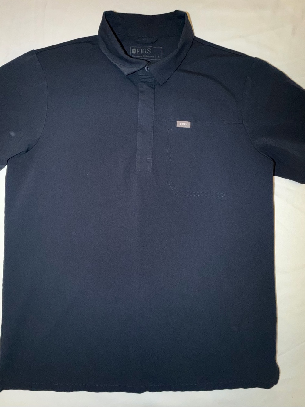 FIGS Men's Dark Navy Polo with Subtle Logo.  Professional Scrubs